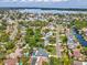 Panoramic aerial view of a waterfront neighborhood with lush greenery and stunning bay views at 1666 N Dakota Ne Ave, St Petersburg, FL 33703