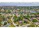 Picturesque aerial of a residential area near a canal, emphasizing waterfront living and neighborhood charm at 1666 N Dakota Ne Ave, St Petersburg, FL 33703