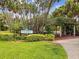 Charming entrance to Kopsick Arboretum with lush landscaping and a shaded seating area at 1666 N Dakota Ne Ave, St Petersburg, FL 33703