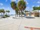 Inviting beach entrance with palm trees, a sandy beach, and restrooms for visitors at 1666 N Dakota Ne Ave, St Petersburg, FL 33703