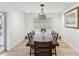 Elegant dining room showcasing a large wooden table, comfortable seating, stylish decor, and plenty of natural light at 1666 N Dakota Ne Ave, St Petersburg, FL 33703