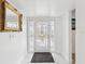 Bright foyer with white walls, marble flooring, a decorative front door, and stylish accents at 1666 N Dakota Ne Ave, St Petersburg, FL 33703