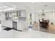 Bright kitchen featuring modern stainless steel appliances, sleek cabinetry, and an adjacent dining area for easy meals at 1666 N Dakota Ne Ave, St Petersburg, FL 33703