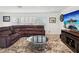 Cozy living room with plush seating, a modern coffee table, and a large flatscreen TV at 1666 N Dakota Ne Ave, St Petersburg, FL 33703