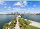 Expansive waterfront with views of the city skyline, palm trees, and a scenic pier, offering tranquility at 1666 N Dakota Ne Ave, St Petersburg, FL 33703