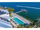 Aerial view of property showcasing the private pool, pier, and waterfront location at 1695 Brightwaters Ne Blvd, St Petersburg, FL 33704