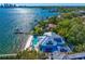 Aerial view of an exquisite waterfront property with a pool, dock, and manicured landscaping at 1695 Brightwaters Ne Blvd, St Petersburg, FL 33704
