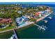 Waterfront houses with docks, pools, and lush landscaping, with the city skyline in the distance at 1695 Brightwaters Ne Blvd, St Petersburg, FL 33704