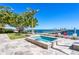 Beautiful backyard with a pool, landscaping, and a private dock, perfect for enjoying outdoor activities and waterfront living at 1695 Brightwaters Ne Blvd, St Petersburg, FL 33704