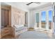Bedroom with custom built-ins and water views at 1695 Brightwaters Ne Blvd, St Petersburg, FL 33704