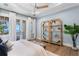 Serene bedroom with balcony, offering ocean views and stylish decor, creating a tranquil retreat at 1695 Brightwaters Ne Blvd, St Petersburg, FL 33704