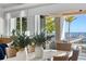 Dining area with a view of the waterfront and outdoor seating area at 1695 Brightwaters Ne Blvd, St Petersburg, FL 33704