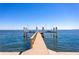 Dock with boat lifts extending into the water, offering convenient boat storage and access for water activities at 1695 Brightwaters Ne Blvd, St Petersburg, FL 33704