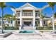Stunning two-story home with a grand entrance, balconies, pool and spa, and beautiful curb appeal at 1695 Brightwaters Ne Blvd, St Petersburg, FL 33704