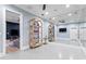 Spacious gym area with mirrored wall and shelving unit at 1695 Brightwaters Ne Blvd, St Petersburg, FL 33704