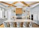 Gourmet kitchen features a marble island, stainless steel appliances, and custom cabinets at 1695 Brightwaters Ne Blvd, St Petersburg, FL 33704