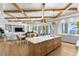 Island kitchen open to living and dining areas, complemented by amazing waterfront views at 1695 Brightwaters Ne Blvd, St Petersburg, FL 33704