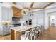 Modern kitchen boasts a large island with seating and stainless-steel appliances at 1695 Brightwaters Ne Blvd, St Petersburg, FL 33704
