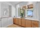 Built-in cabinets offering extra counter space next to a large window with views of the outside at 1695 Brightwaters Ne Blvd, St Petersburg, FL 33704
