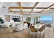 Open-concept living room with water views, custom built-ins, and elegant dining area at 1695 Brightwaters Ne Blvd, St Petersburg, FL 33704