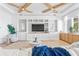 Stylish living area showcasing a coffered ceiling, modern built-ins, and a serene ambiance at 1695 Brightwaters Ne Blvd, St Petersburg, FL 33704