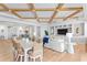 Open-concept living space with coffered ceiling, hardwood floors, and a neutral color palette at 1695 Brightwaters Ne Blvd, St Petersburg, FL 33704