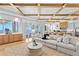 Bright living room offering a picturesque view of the ocean and seamlessly connected to the kitchen at 1695 Brightwaters Ne Blvd, St Petersburg, FL 33704