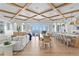 Open-concept living area with waterfront views, featuring a dining area and kitchen, perfect for entertaining at 1695 Brightwaters Ne Blvd, St Petersburg, FL 33704