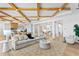 Spacious living area with coffered ceilings seamlessly connects to the kitchen and other living spaces at 1695 Brightwaters Ne Blvd, St Petersburg, FL 33704