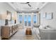 A cozy living room with water views, comfortable sofa, and stylish furnishings at 1695 Brightwaters Ne Blvd, St Petersburg, FL 33704