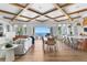 Open-concept living space with water views featuring hardwood floors, and dining areas at 1695 Brightwaters Ne Blvd, St Petersburg, FL 33704