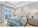 Beautiful bedroom with serene ocean views, elegant furnishings, and soft, calming colors at 1695 Brightwaters Ne Blvd, St Petersburg, FL 33704