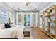 A spacious main bedroom boasts hardwood floors and French doors to the patio at 1695 Brightwaters Ne Blvd, St Petersburg, FL 33704