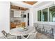 Covered outdoor kitchen with bar seating, providing a convenient space for cooking and entertaining guests at 1695 Brightwaters Ne Blvd, St Petersburg, FL 33704