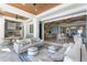 Stylish outdoor living space with comfortable seating, outdoor kitchen, and seamless indoor-outdoor flow at 1695 Brightwaters Ne Blvd, St Petersburg, FL 33704