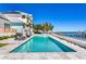 A stunning waterfront pool with views of the dock and the tranquil bay at 1695 Brightwaters Ne Blvd, St Petersburg, FL 33704