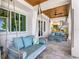 Inviting porch with comfortable swing seating, offering a relaxing outdoor space with scenic views at 1695 Brightwaters Ne Blvd, St Petersburg, FL 33704