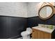 Stylish powder room featuring elegant fixtures, modern vanity, and decorative wallpaper for a sophisticated touch at 1695 Brightwaters Ne Blvd, St Petersburg, FL 33704
