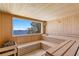 This beautiful sauna room features wood-lined walls and windows with ocean view at 1695 Brightwaters Ne Blvd, St Petersburg, FL 33704