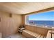 Relaxing sauna room features wood paneling, a bench, and a picturesque water view at 1695 Brightwaters Ne Blvd, St Petersburg, FL 33704