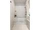 Modern walk-in shower featuring patterned tiles, rainfall shower head, and marble accents at 1695 Brightwaters Ne Blvd, St Petersburg, FL 33704