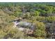 An aerial view shows the house is surrounded by lush trees at 17913 Greensboro St, Spring Hill, FL 34610