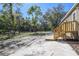 Exterior angle of the backyard with a small wood porch entry and a view of the neighborhood at 17913 Greensboro St, Spring Hill, FL 34610