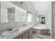 Bathroom with dual sinks, bathtub, and separate shower, all in a neutral color palette at 17913 Greensboro St, Spring Hill, FL 34610