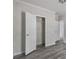 Bedroom featuring closet with ample storage space, modern design and laminate floors at 17913 Greensboro St, Spring Hill, FL 34610