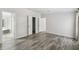 Bedroom featuring hardwood flooring, neutral walls, and multiple entryways at 17913 Greensboro St, Spring Hill, FL 34610