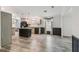 Open kitchen and dining area with island, wooden cabinets and hard surface flooring at 17913 Greensboro St, Spring Hill, FL 34610