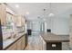 Kitchen area featuring kitchen island with hard surface flooring at 17913 Greensboro St, Spring Hill, FL 34610
