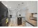 Spacious kitchen with island, dark appliances, and light wood cabinets at 17913 Greensboro St, Spring Hill, FL 34610