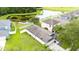 Aerial view of backyard featuring lush greenery and scenic pond views at 18150 Leamington Ln, Land O Lakes, FL 34638